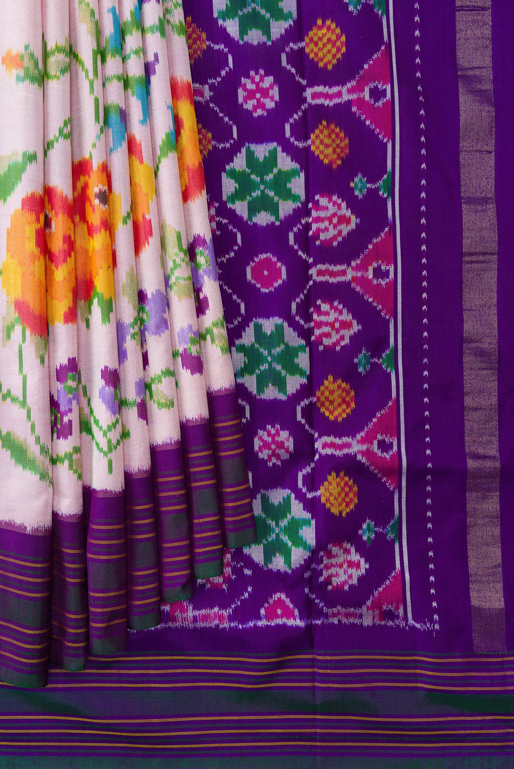 Pleats and pallu of Pink Double Ikat Saree with Plain Body and Ikat Border. 