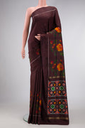 Brown Dual Tone Double Ikat Saree with Plain Body and Ikat Border.  displayed on a mannequin