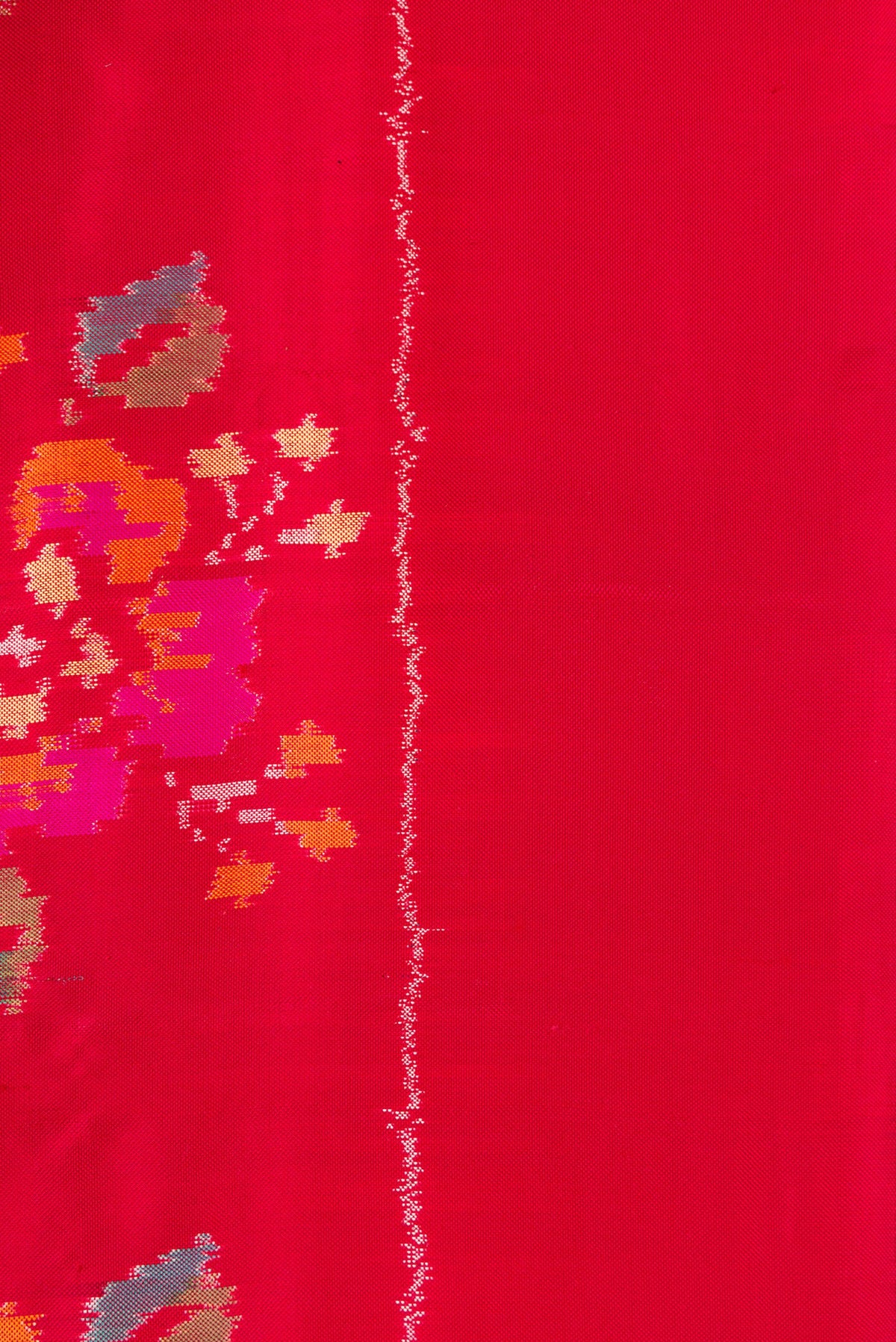 Border image of Red Dual Tone Double Ikat Saree with Ikat Print on the body and Zari Border. 