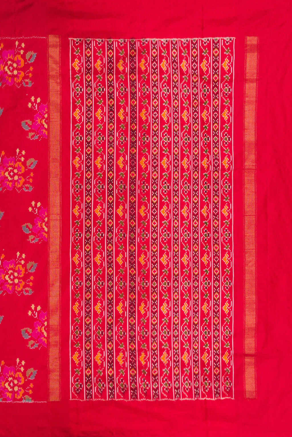 Close up image of the pallu of Red Dual Tone Double Ikat Saree with Ikat Print on the body and Zari Border. 