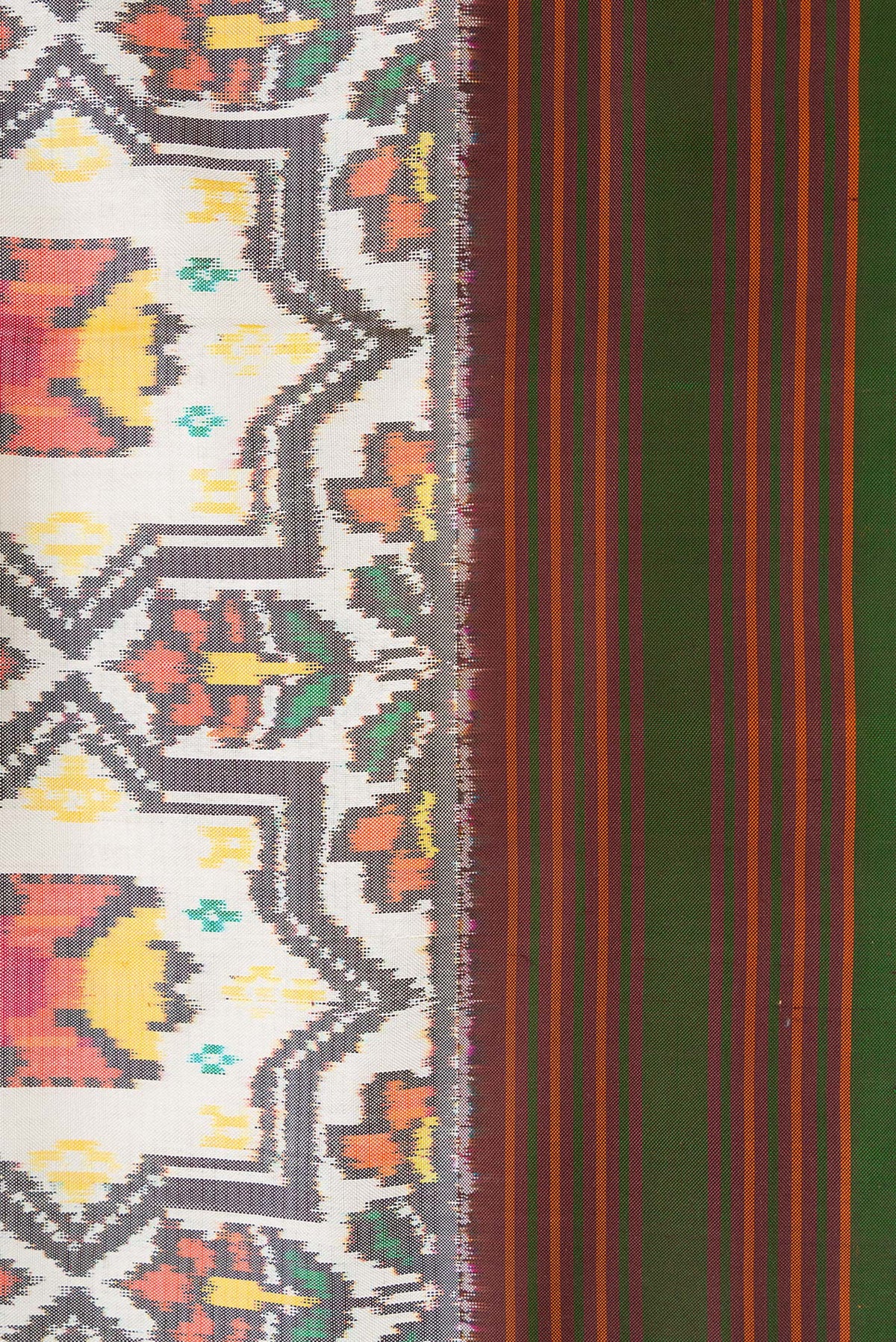 Border image of Beige Dual Tone Double Ikat Saree with Ikat Print on the body and Thread Border. 