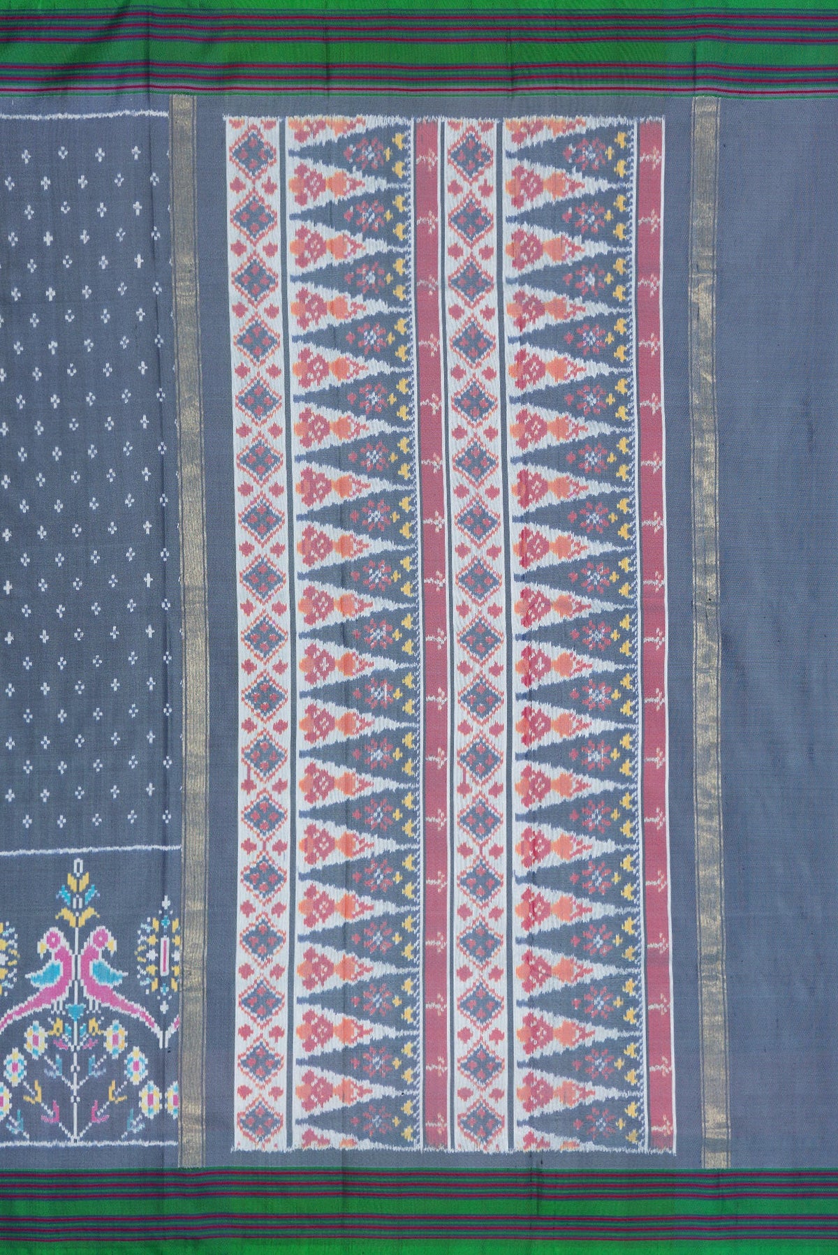 Close up image of the pallu of Grey Dual Tone Double Ikat Saree with Ikat Print on the body and Ikat Border. 