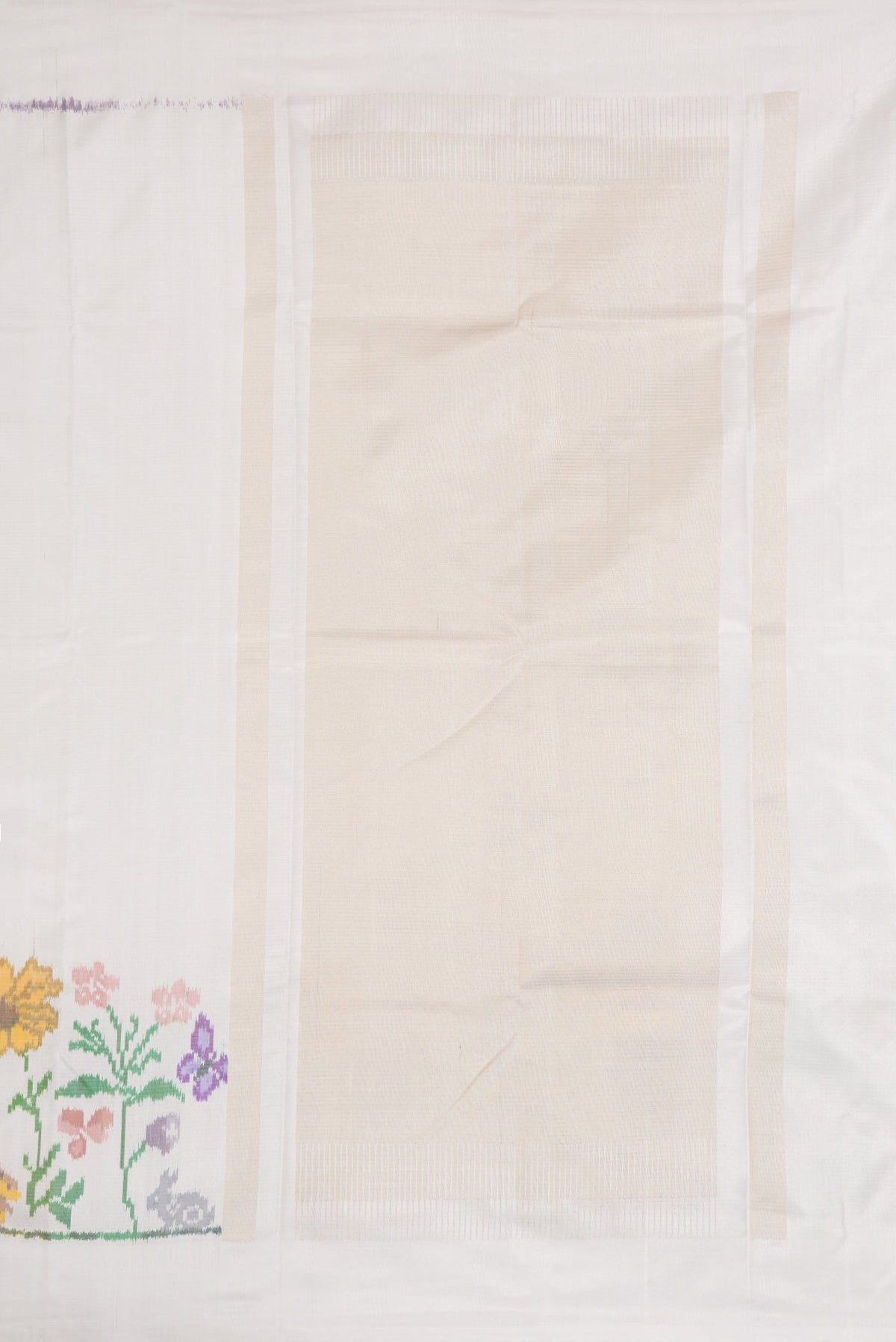 Close up image of the pallu of Off White Dual Tone Double Ikat Saree with Plain Body and Ikat Border. 