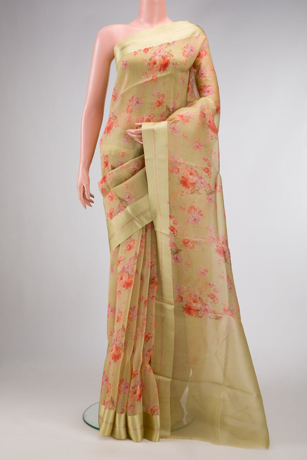 Pista Green Dual Tone Organza Silk Saree with Printed design on the body and Zari And Thread Border.  displayed on a mannequin