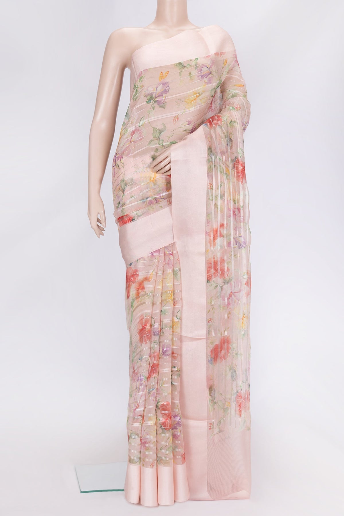 Rose Gold Dual Tone Organza Silk Saree with Stripes on the body and Thread Border.  displayed on a mannequin