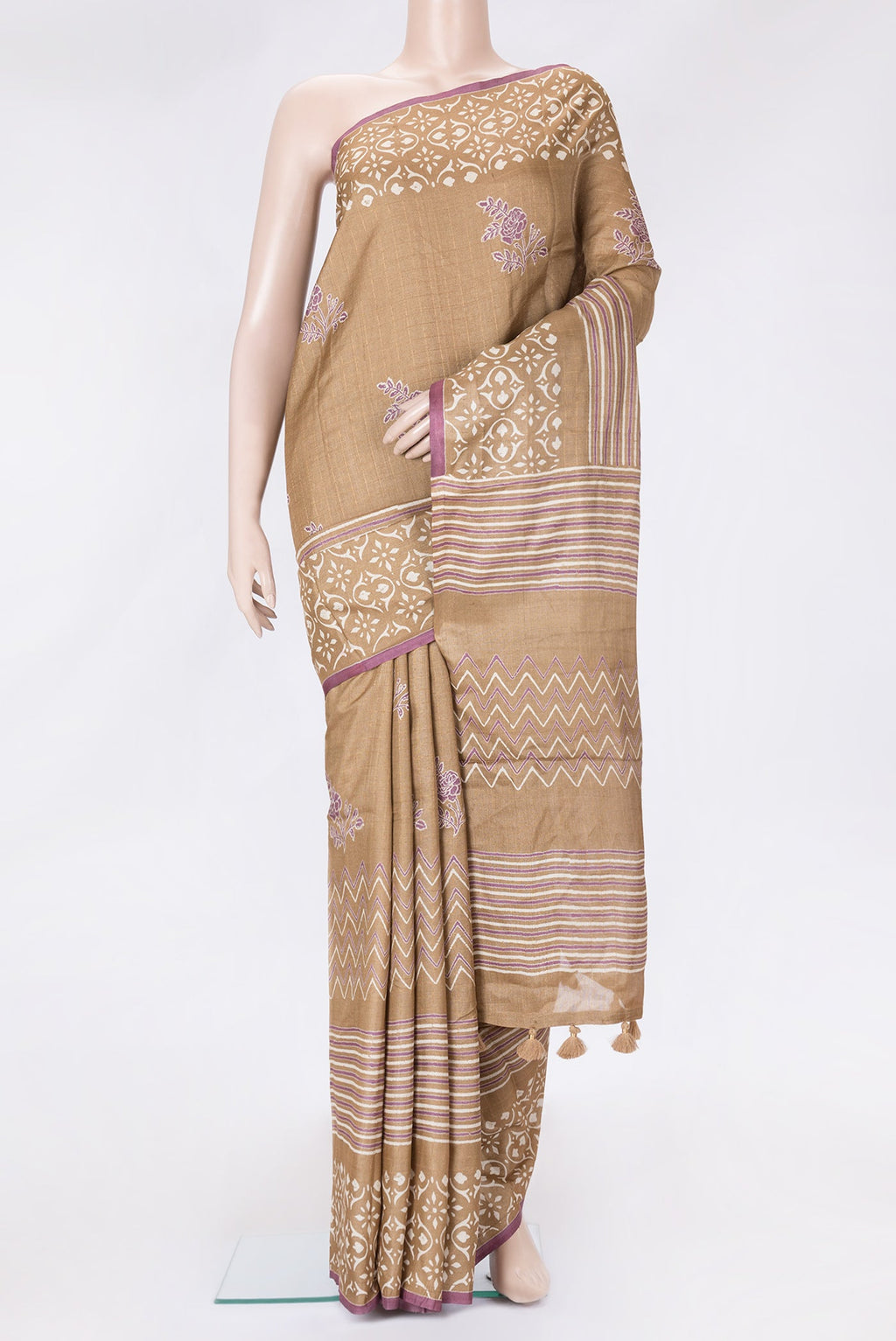 Caramel Dual Tone Tussar Silk Saree with Printed design on the body and Printed Border.  displayed on a mannequin