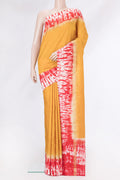 Yellow Tussar Silk Saree with Plain Body and Zari Border.  displayed on a mannequin