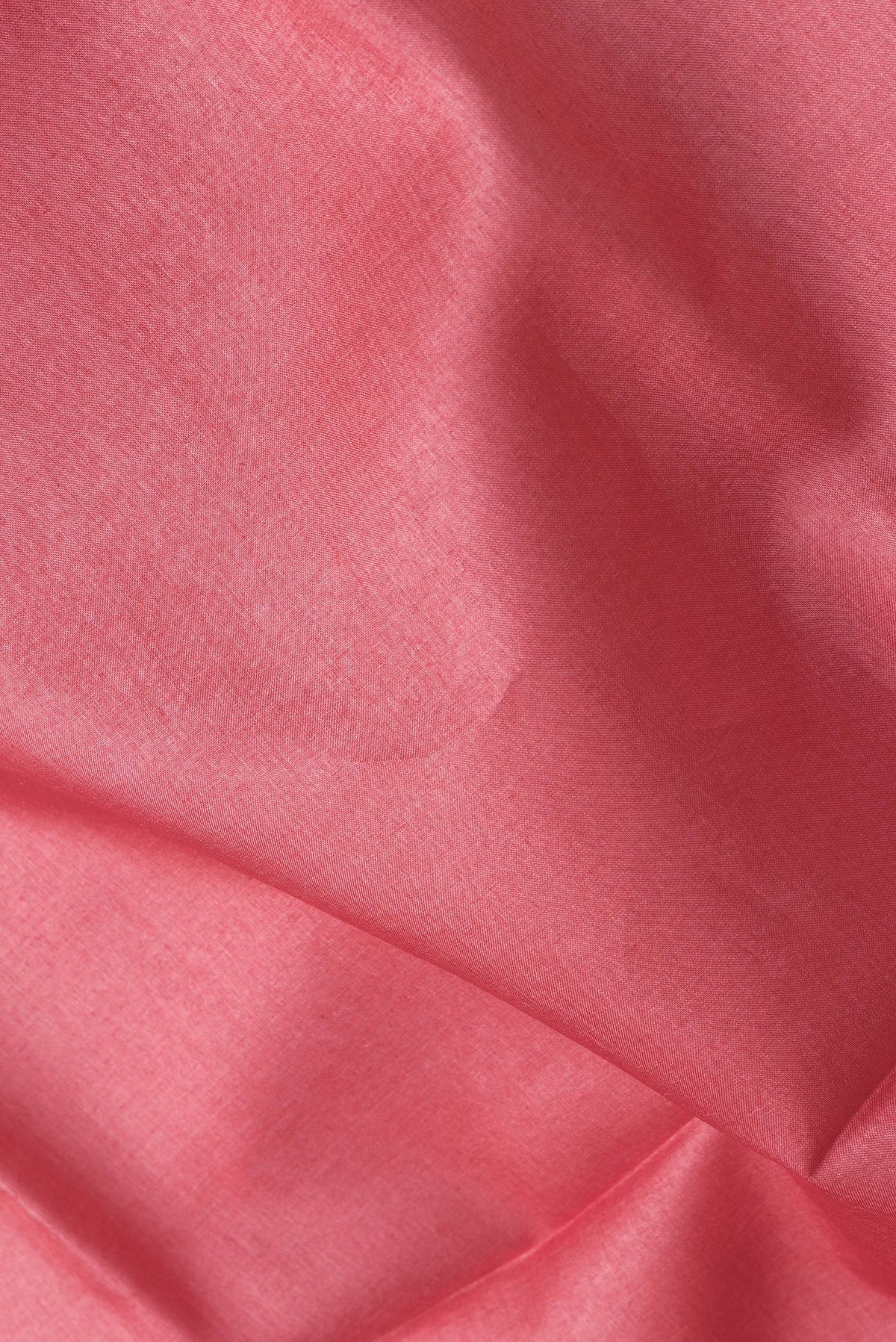 Close up of Pink Dual Tone Tussar Silk Saree with Plain Body and Printed Border.  displaying folds