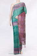 Green Tussar Silk Saree with Stripes on the body and Printed Border.  displayed on a mannequin
