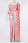 Pink Tussar Silk Saree with Zari Butta on the body and Zari Border.  displayed on a mannequin