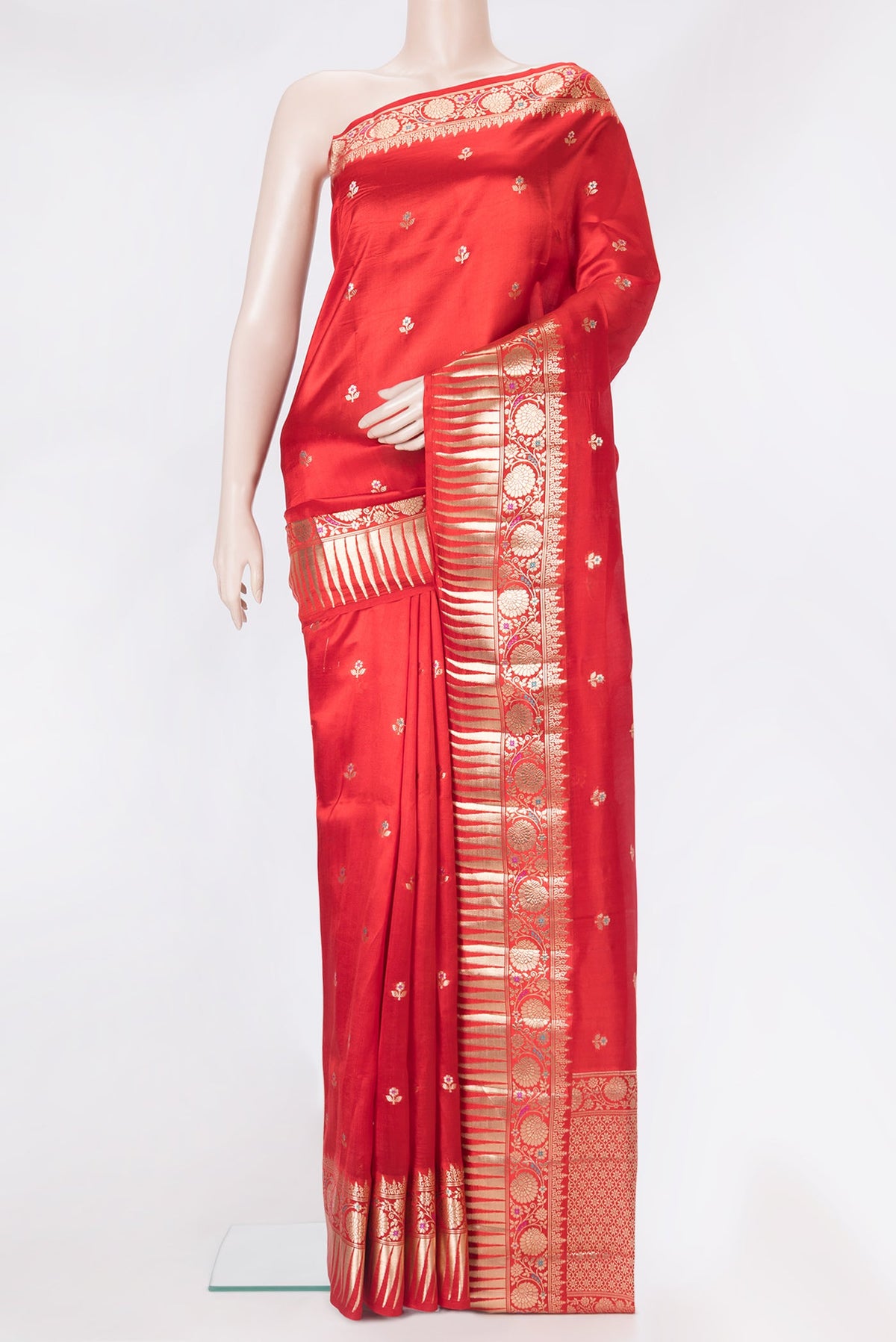 Red Tussar Silk Saree with Zari Butta on the body and Zari Border.  displayed on a mannequin
