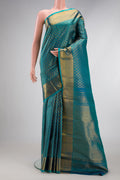 Peacock Blue Dual Tone Kanchipuram Silk Saree with Zari Brocade on the body and Zari Border.  displayed on a mannequin