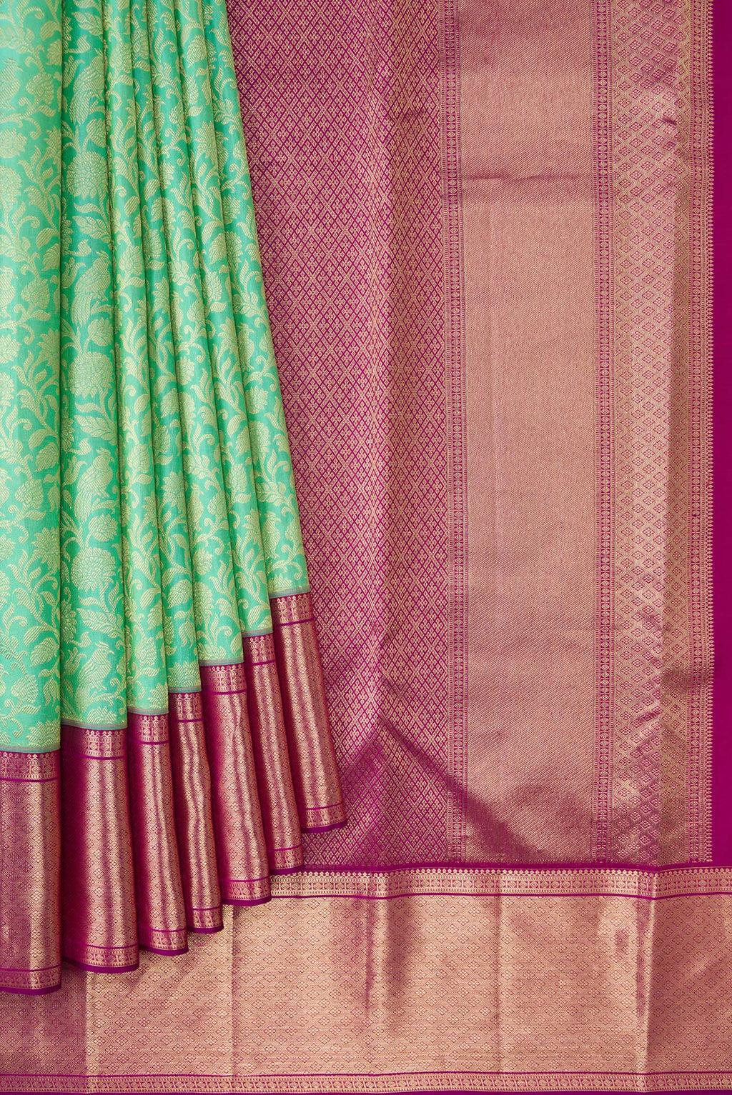 Pleats and pallu of Turquoise Kanchipuram Silk Saree with Zari Brocade on the body and Zari Border. 