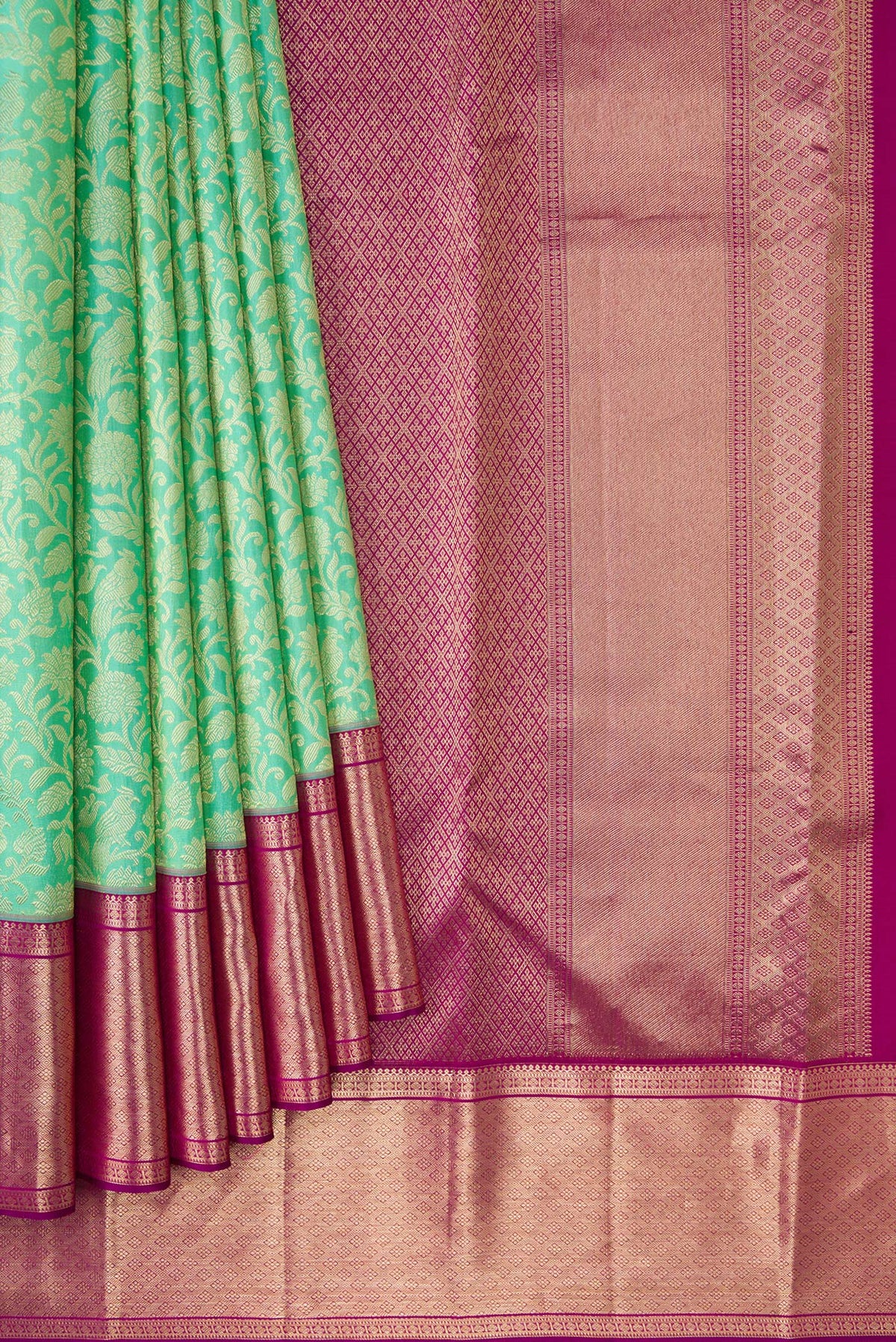 Pleats and pallu of Turquoise Kanchipuram Silk Saree with Zari Brocade on the body and Zari Border. 