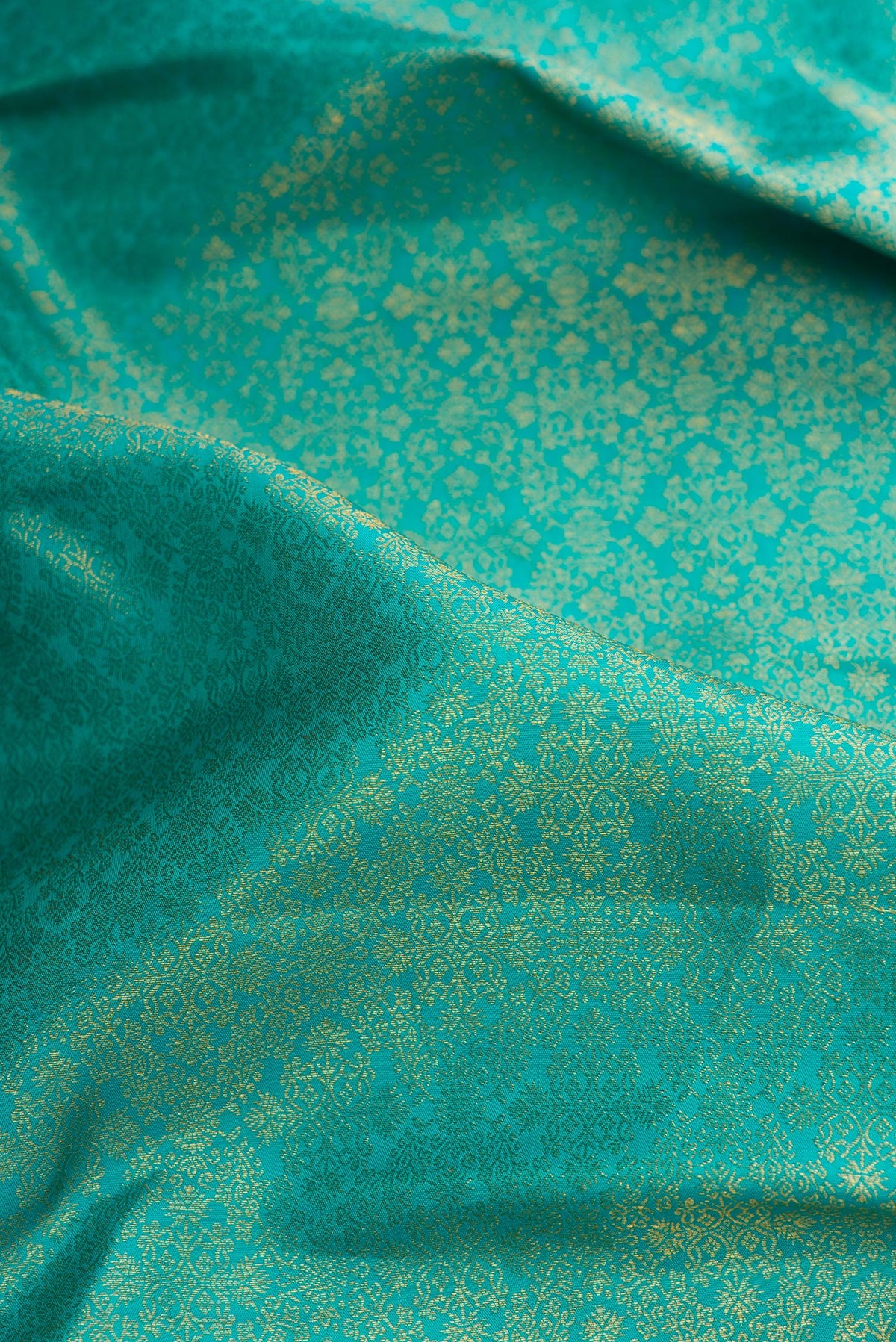 Close up of Blue Kanjivaram Silk Saree with Zari Brocade on the body and Zari Border.  displaying folds