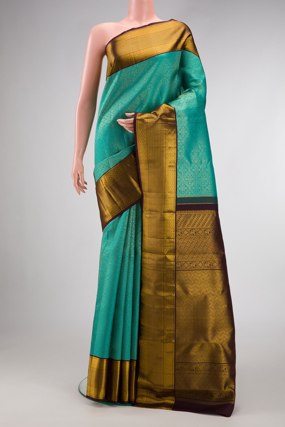 Blue Kanjivaram Silk Saree with Zari Brocade on the body and Zari Border.  displayed on a mannequin