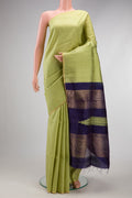 Pista Green Raw Silk Saree with Checked design on the body and Zari Border.  displayed on a mannequin