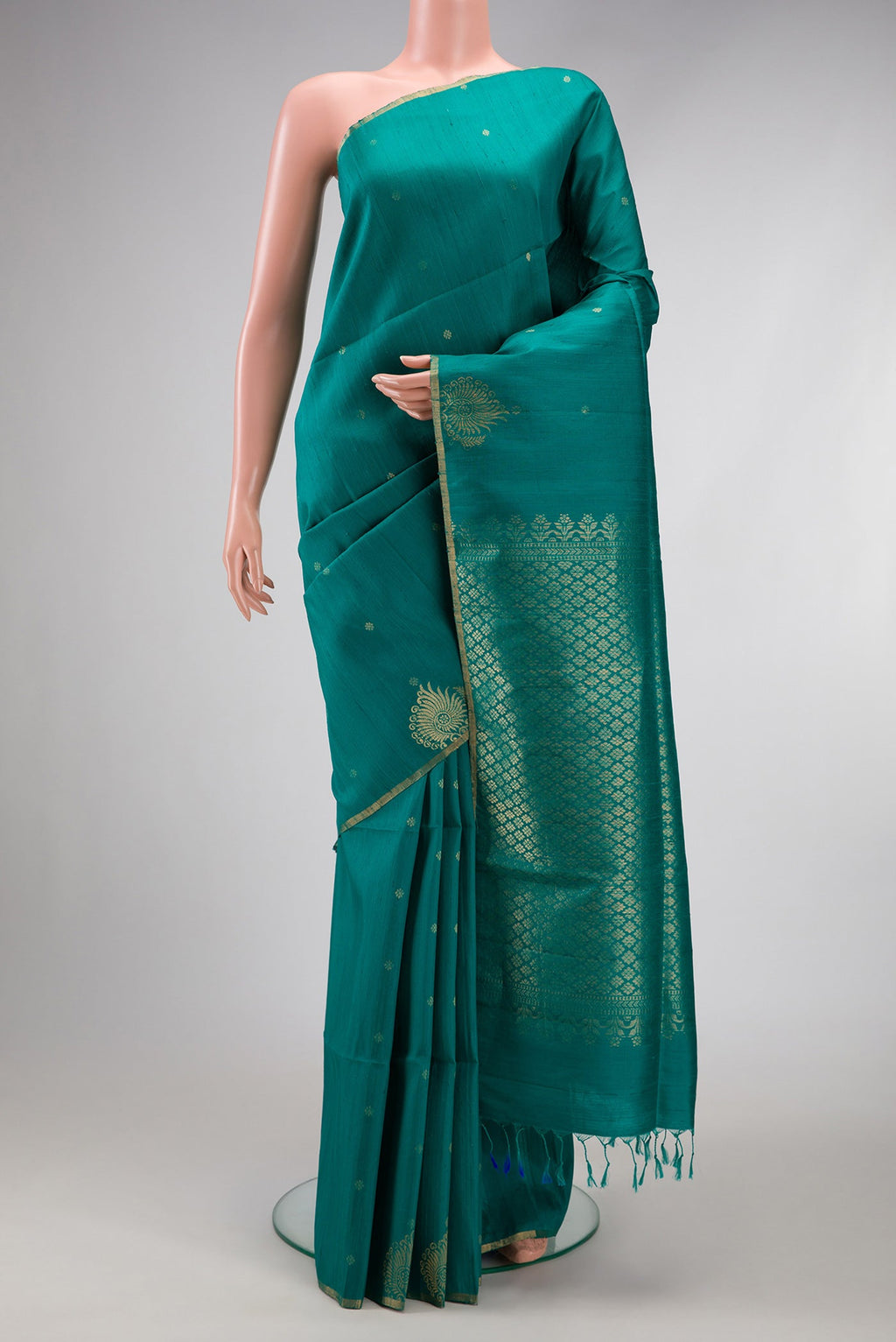 Peacock Blue Dual Tone Raw Silk Saree with Zari Butta on the body and Fancy Border.  displayed on a mannequin