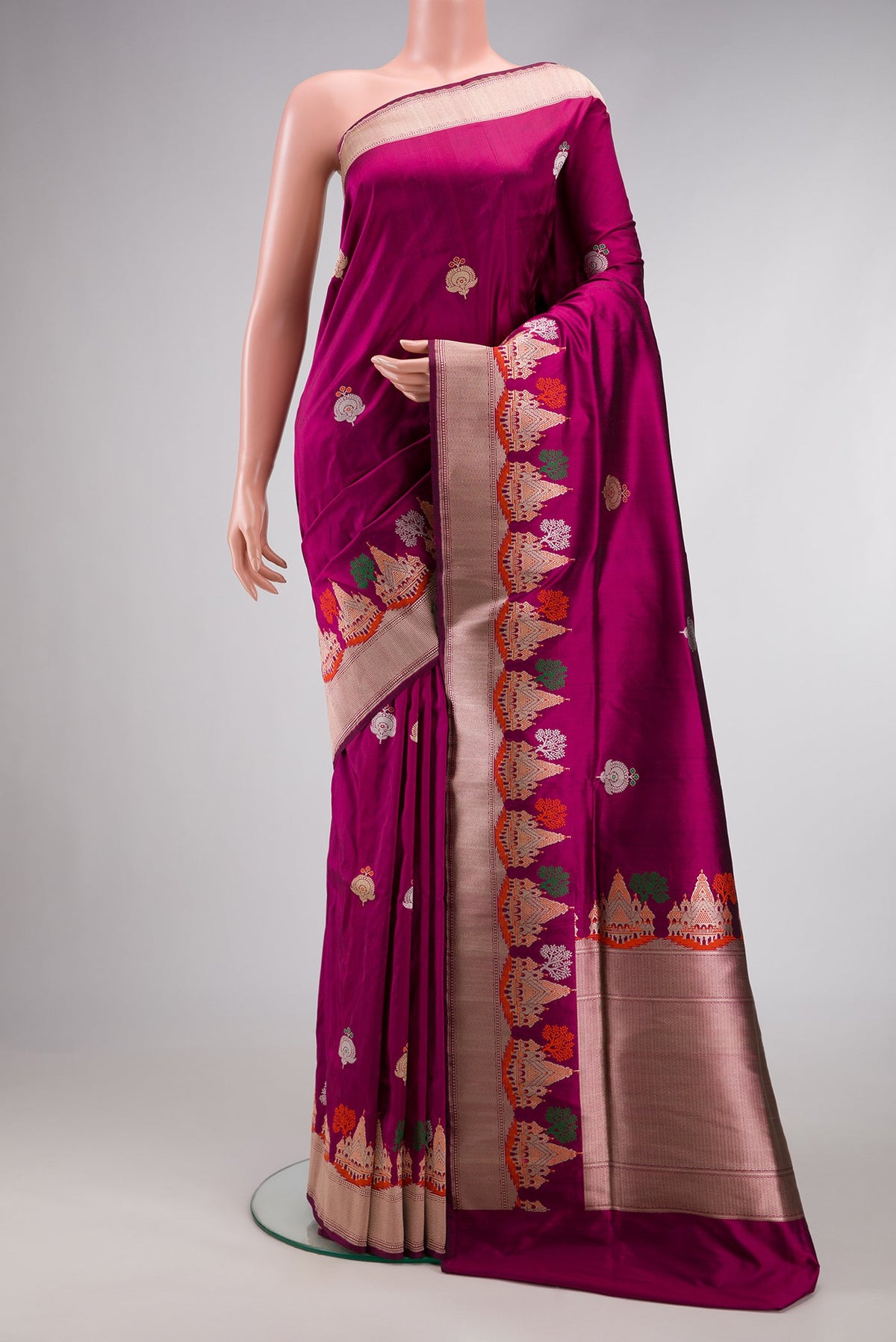Magenta Dual Tone Banarasi Silk Saree with Zari And Thread Butta on the body and Fancy Border.  displayed on a mannequin