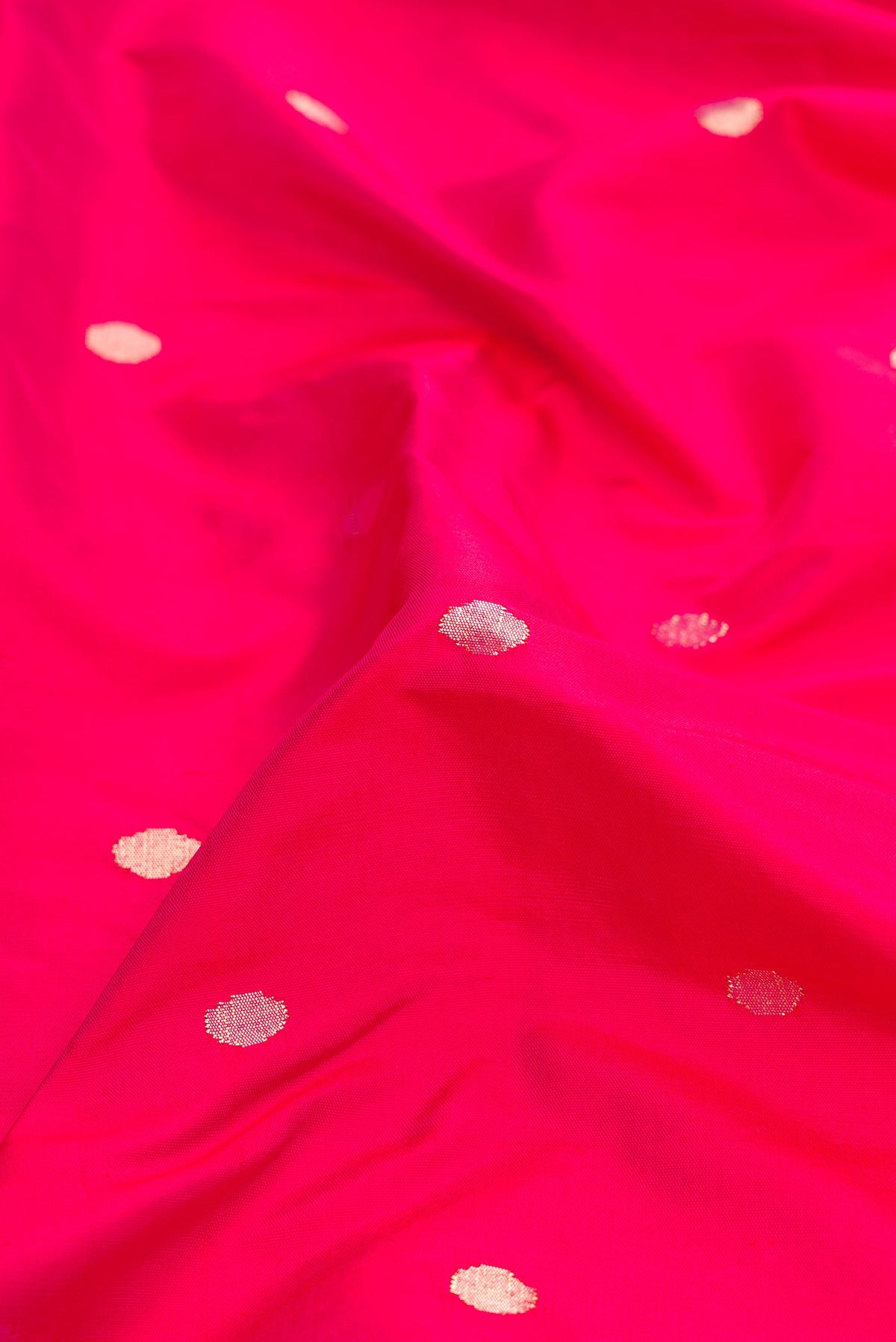 Close up of Pure Silk Pure Zari Pink Dual Tone Paithani Saree with Zari Butta on the body and Paithani Border.  displaying folds
