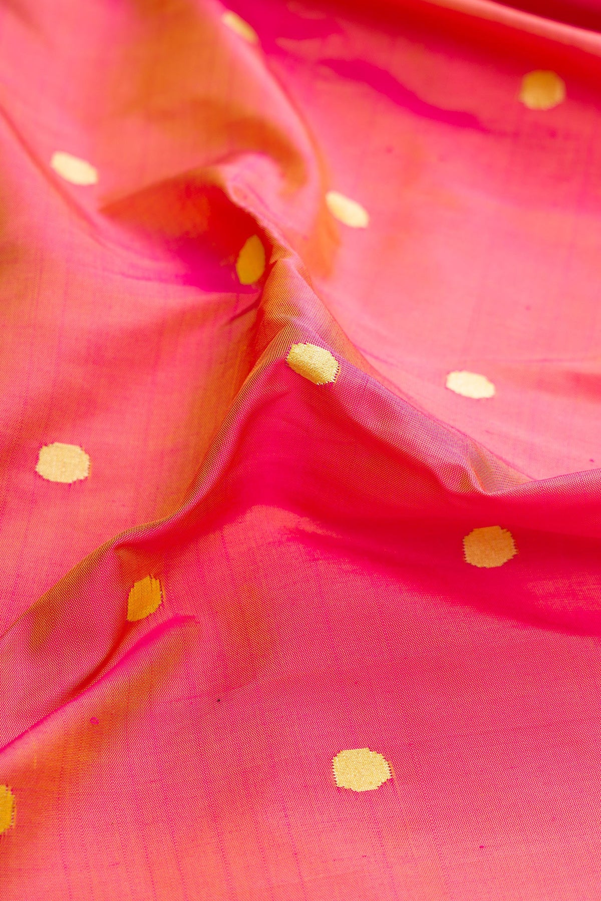Close up of Pure Silk Pure Zari Pink Dual Tone Paithani Saree with Zari Butta on the body and Paithani Border.  displaying folds