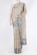 Beige Dual Tone Tussar Silk Saree with Stripes on the body and Embroidery Border.  displayed on a mannequin