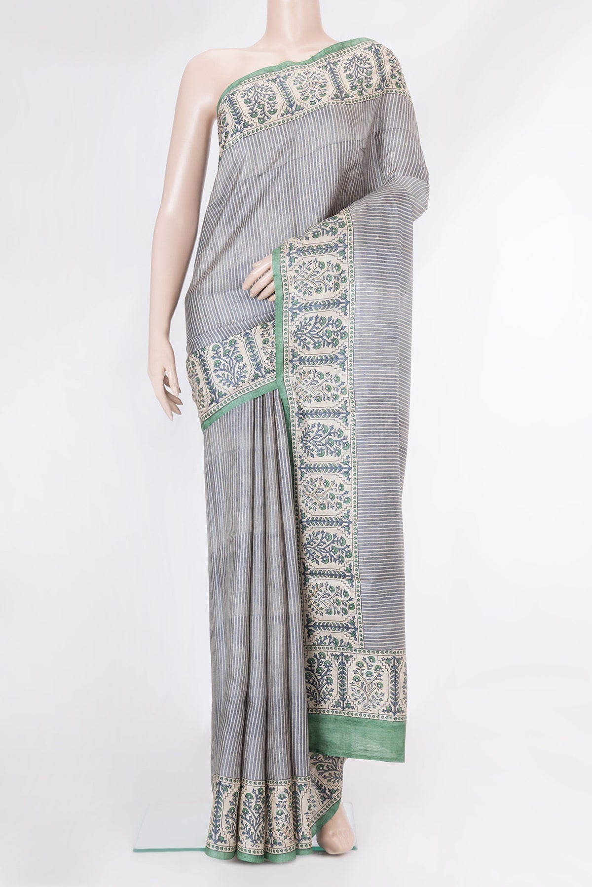 Grey Dual Tone Tussar Silk Saree with Stripes on the body and Embroidery Border.  displayed on a mannequin