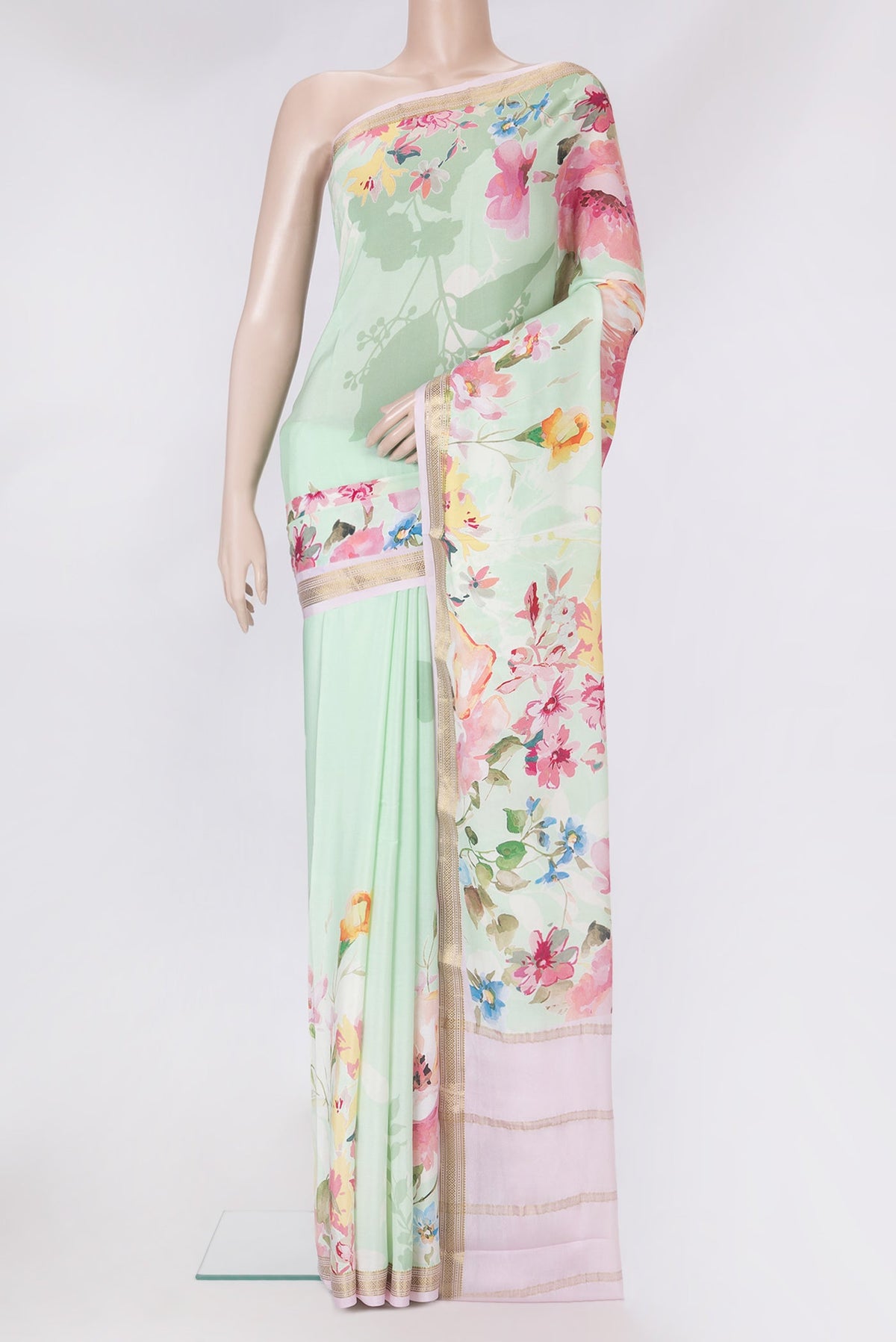 Pista Green Mysore Silk Saree with Printed design on the body and Zari Border.  displayed on a mannequin