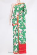 Green Mysore Silk Saree with Floral Print on the body and Zari Border.  displayed on a mannequin