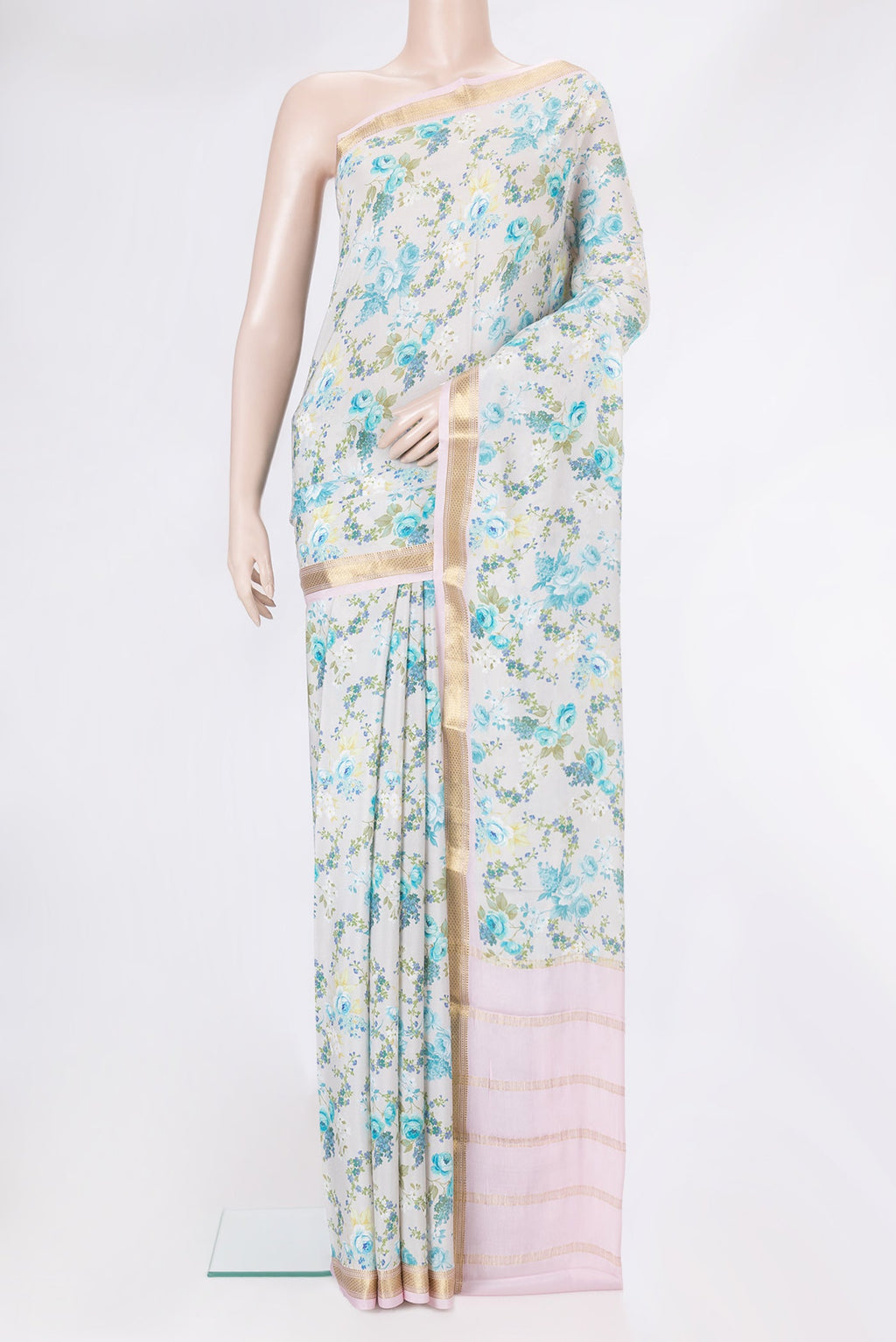 Off White Dual Tone Crepe Saree with Printed design on the body and Zari Border.  displayed on a mannequin
