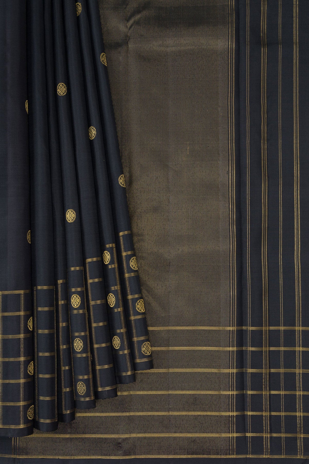 Pleats and pallu of Black Kanchipuram Silk Saree with Zari Butta on the body and Checks Border. 