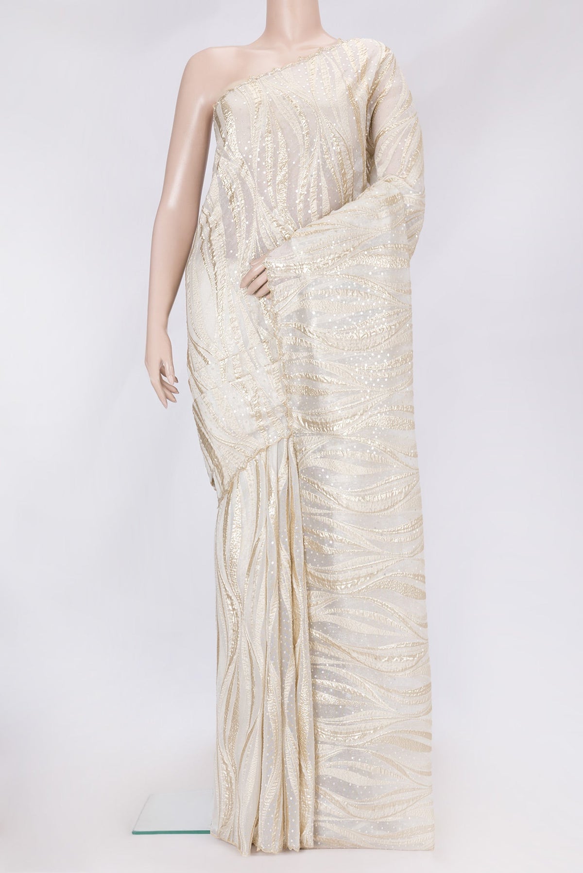 Gold Dual Tone Organza Silk Saree with Embroidery on the body and Embroidery Border.  displayed on a mannequin