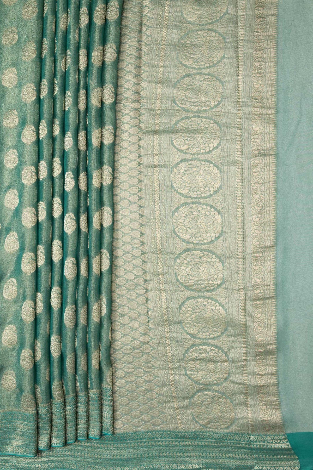 Pleats and pallu of Sea Green Dual Tone Mysore Georgette Saree with Zari Brocade on the body and Zari Border. 