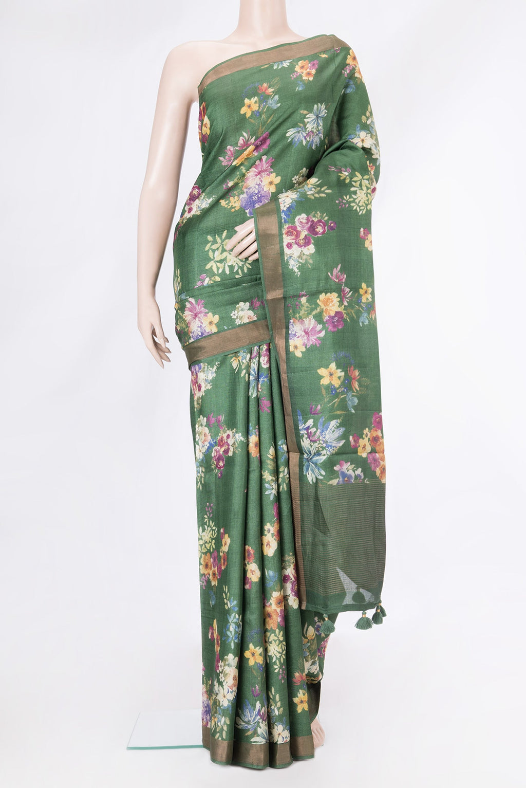 Olive Green Tussar Silk Saree with Floral Print on the body and Zari Border.  displayed on a mannequin