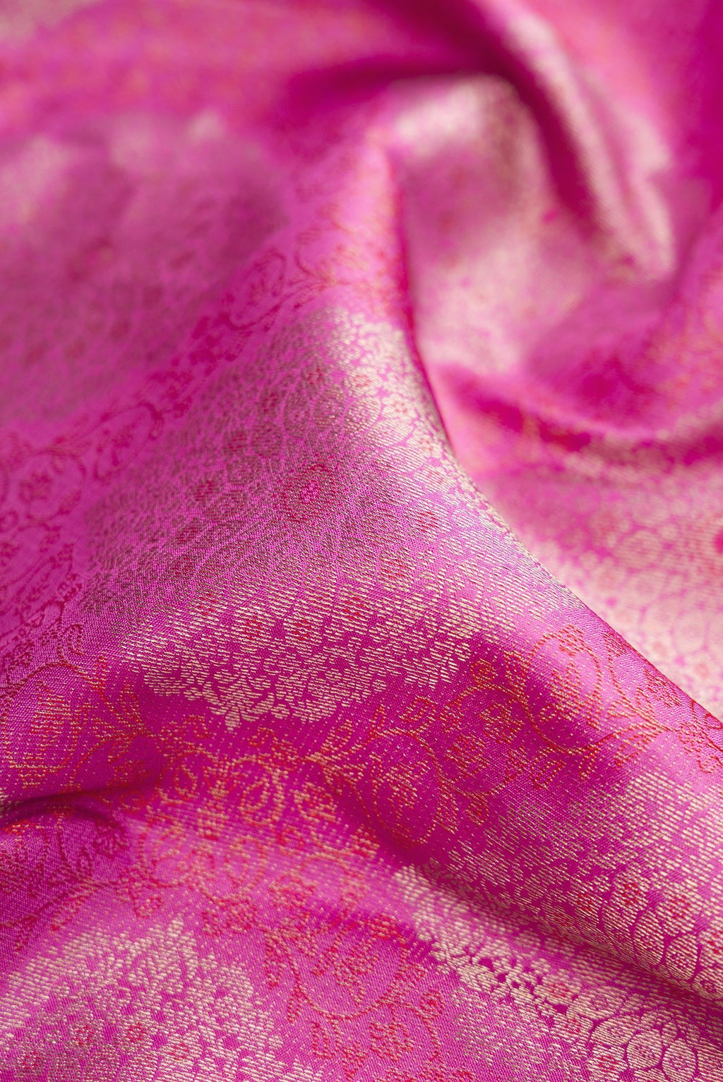 Close up of Pink Dual Tone Kanjivaram Silk Saree with Zari Brocade on the body and Zari Border.  displaying folds