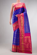 Pure Silk Pure Zari Royal Blue Dual Tone Kanchipuram Saree with Stripes on the body and Zari Border.  displayed on a mannequin