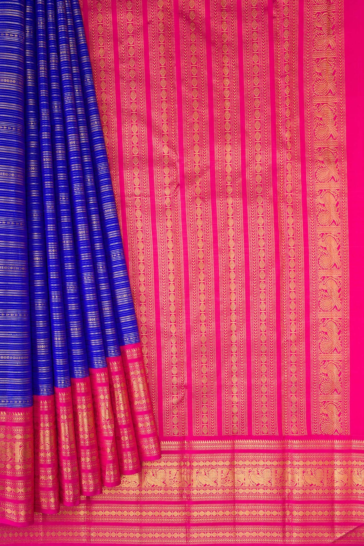 Pleats and pallu of Pure Silk Pure Zari Royal Blue Dual Tone Kanchipuram Saree with Stripes on the body and Zari Border. 