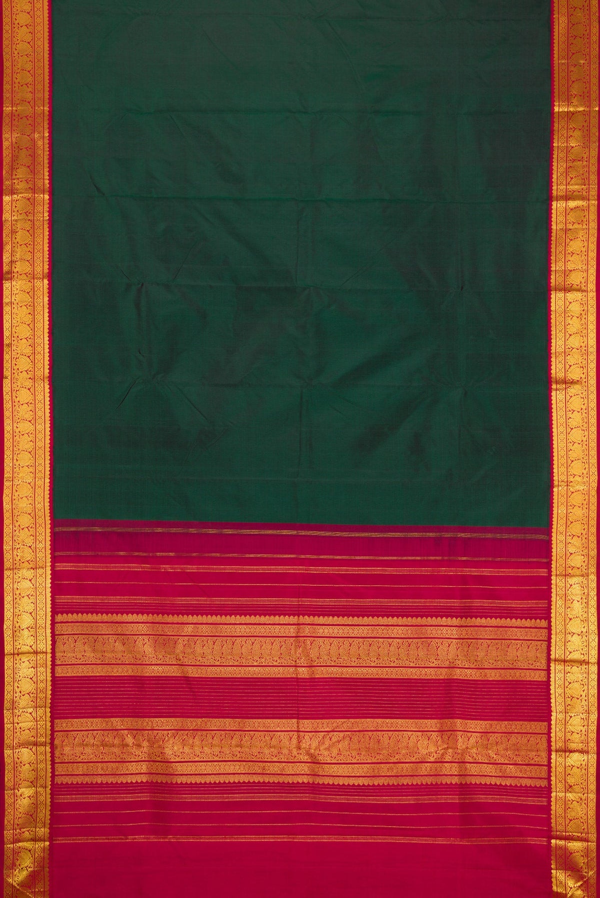 Flat view of Bottle Green Kanjivaram Silk Saree with Plain Body and Zari Border. 
