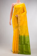 Yellow Dual Tone Soft Silk Saree with Zari Butta on the body and Zari Border.  displayed on a mannequin