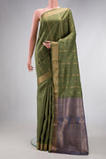 Mehandi Green Dual Tone Soft Silk Saree with Zari Butta on the body and Zari Border.  displayed on a mannequin