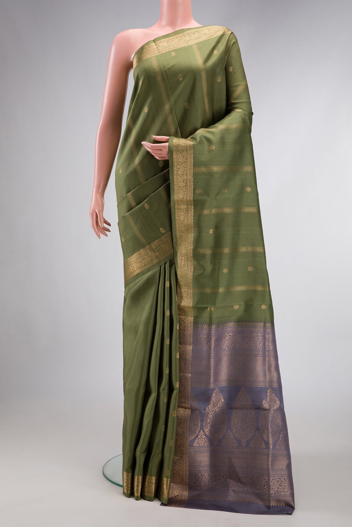 Mehandi Green Dual Tone Soft Silk Saree with Zari Butta on the body and Zari Border.  displayed on a mannequin