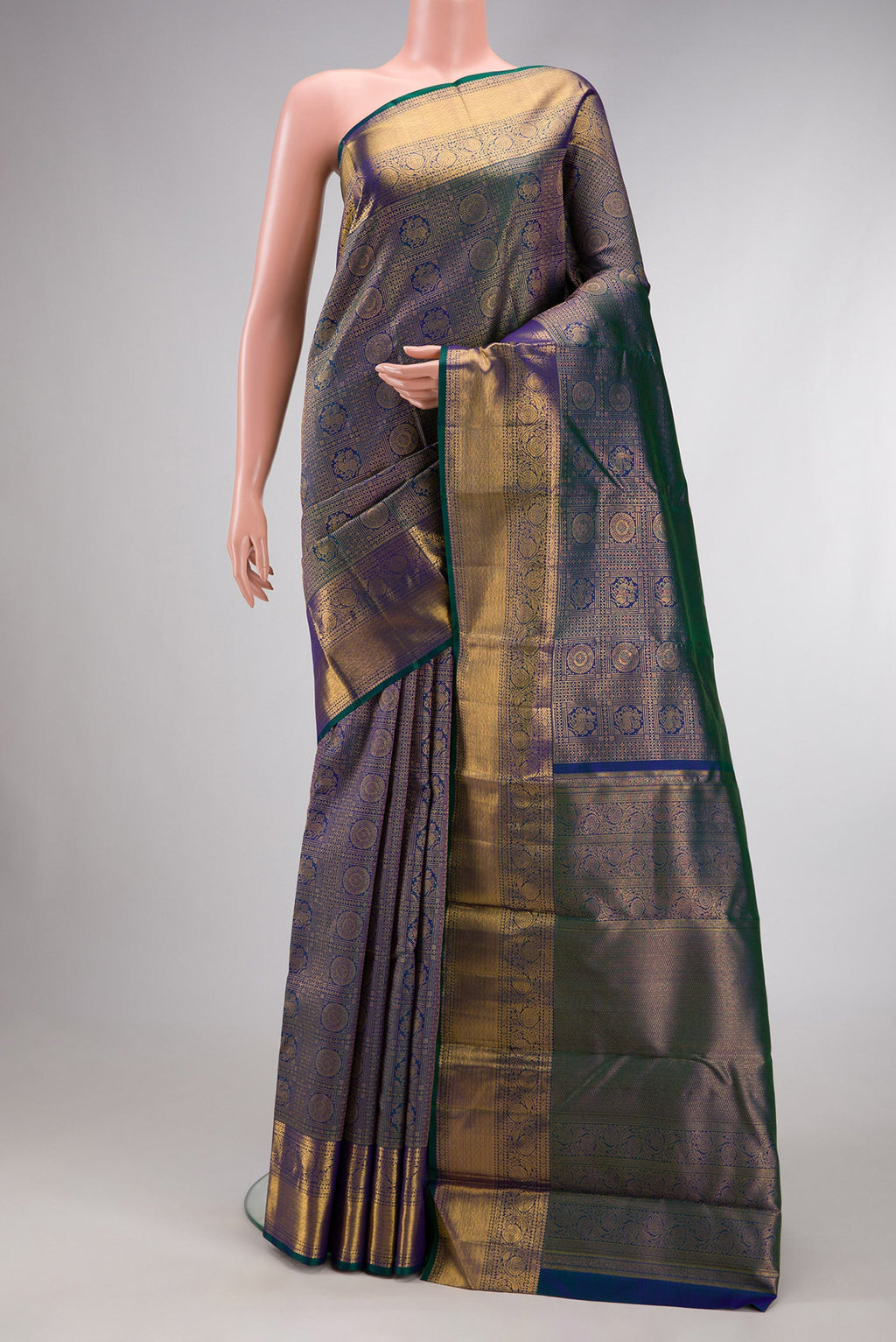 Peacock Blue Dual Tone Kanchipuram Silk Saree with Zari Brocade on the body and Zari Border.  displayed on a mannequin