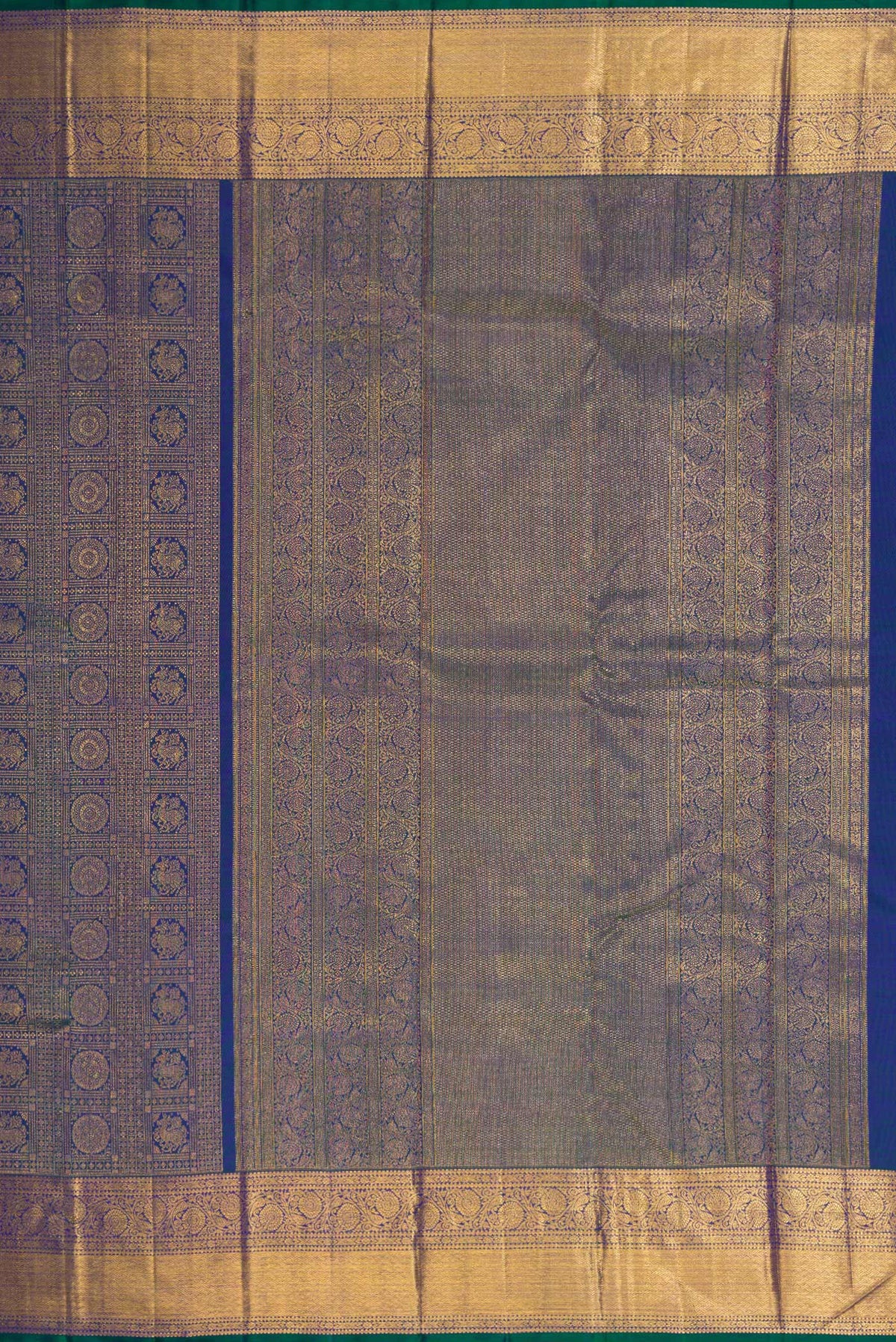 Close up image of the pallu of Peacock Blue Dual Tone Kanchipuram Silk Saree with Zari Brocade on the body and Zari Border. 