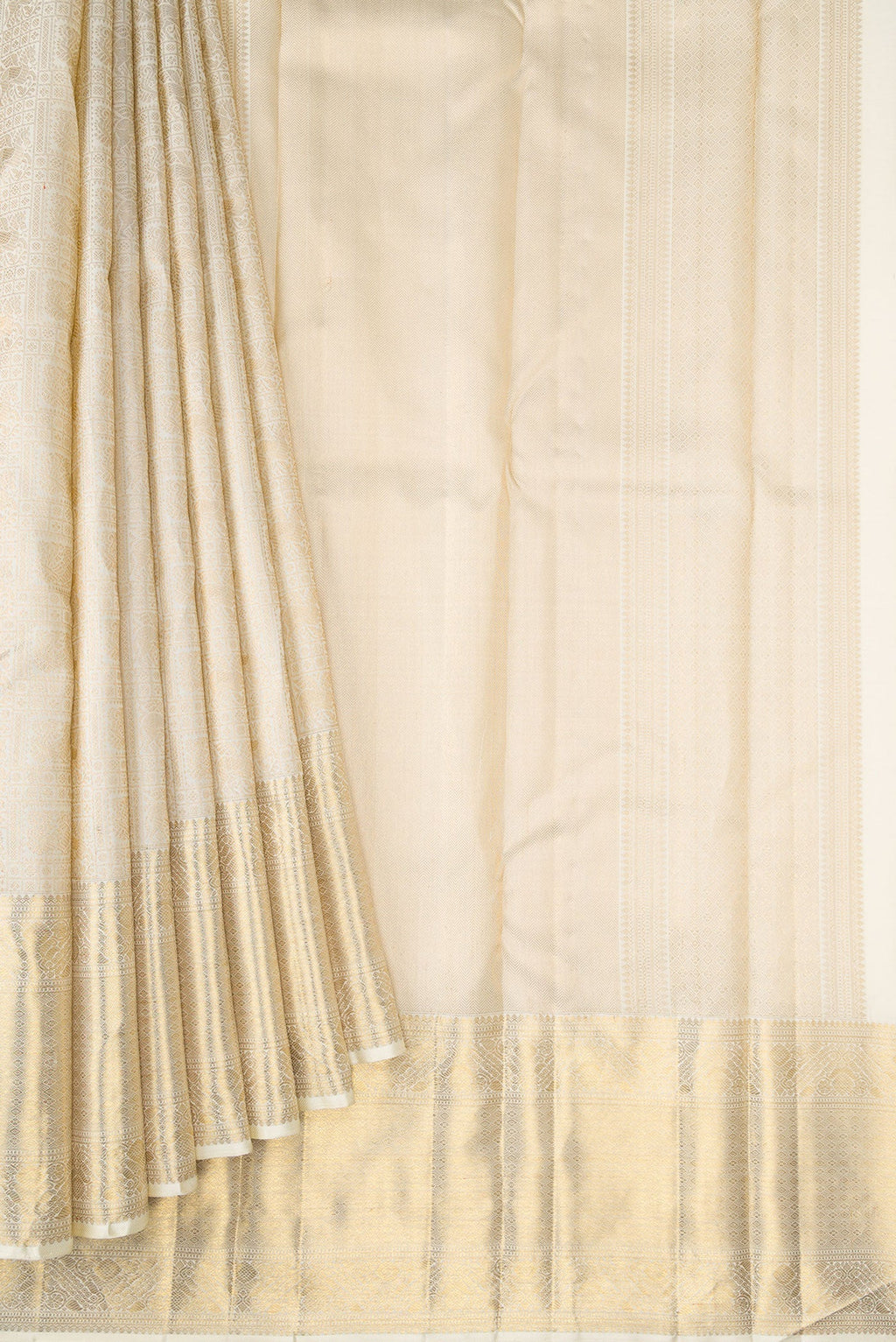 Pleats and pallu of Off White Dual Tone Kanchipuram Silk Saree with Zari Brocade on the body and Zari Border. 