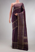 Purple Kanchipuram Silk Saree with Checked design on the body and Plain Border.  displayed on a mannequin