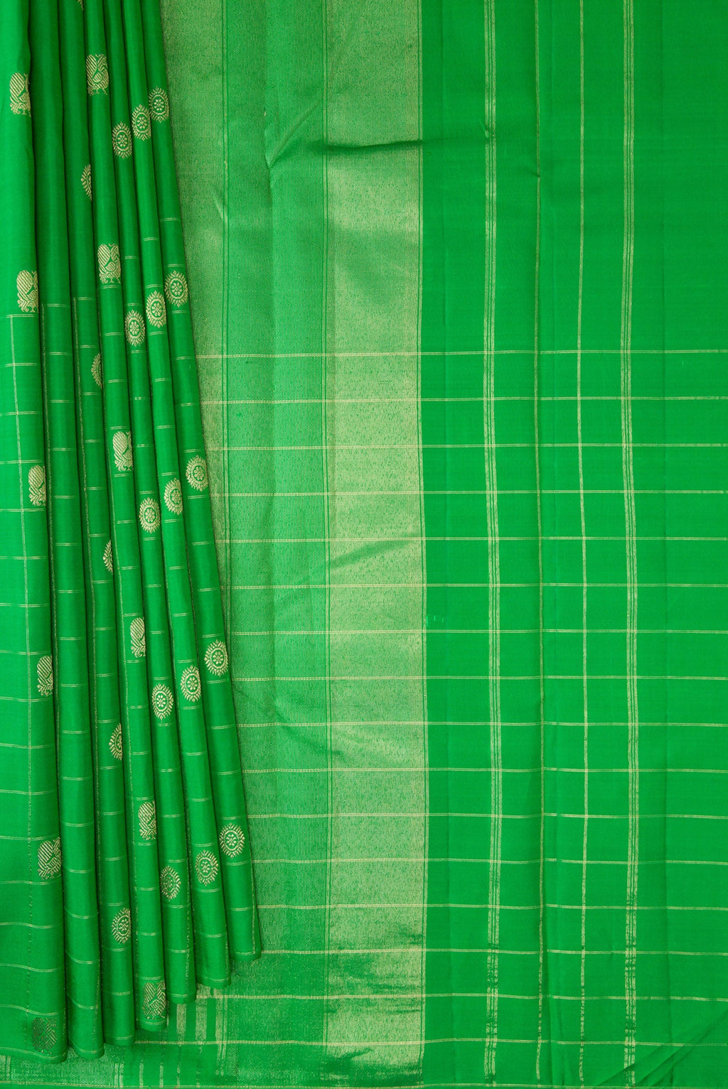 Pleats and pallu of Green Kanchipuram Silk Saree with Zari Butta on the body and Checks Border. 