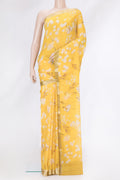Yellow Mysore Chiffon Saree with Printed design on the body and Zari Border.  displayed on a mannequin