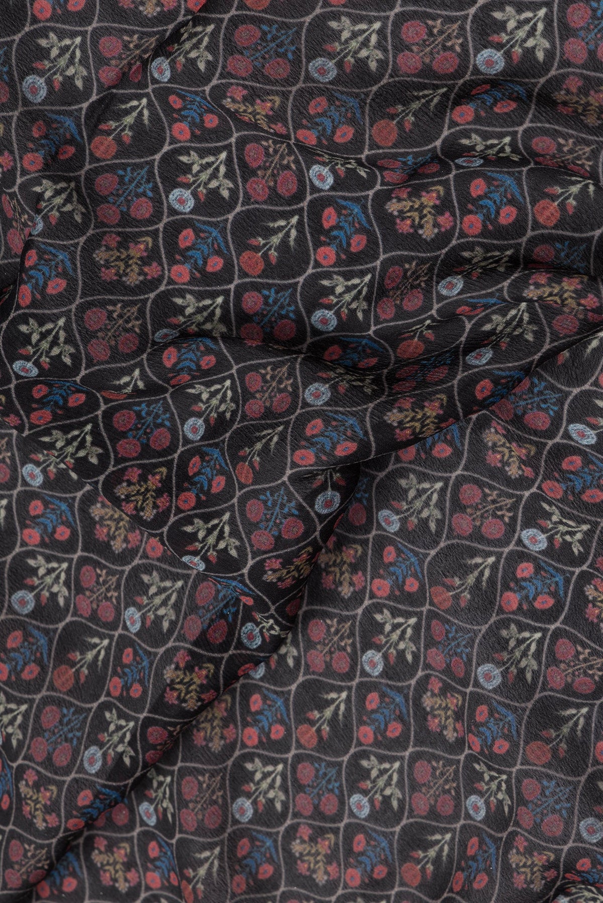 Close up of Black Mysore Chiffon Saree with Printed design on the body and Zari Border.  displaying folds