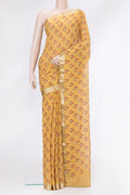 Mustard Mysore Chiffon Saree with Printed design on the body and Zari Border.  displayed on a mannequin