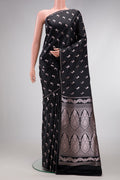 Black Dual Tone Blended Banarasi Silk Saree with Zari Butta on the body and Thin Zari Line.  displayed on a mannequin
